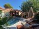 Outdoor pool with lounge chairs and a view of the house for a relaxing outdoor experience at 3877 Platis Cir, Las Vegas, NV 89103
