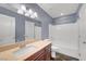 This bathroom features a stylish vanity and a shower-tub combo with white tiled walls at 3908 Total Eclipse St, Las Vegas, NV 89129