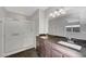 Modern bathroom featuring a double sink vanity and a glass-enclosed shower at 3908 Total Eclipse St, Las Vegas, NV 89129