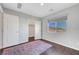 Comfortable bedroom with hardwood floors and a scenic view at 3908 Total Eclipse St, Las Vegas, NV 89129