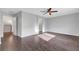 A bedroom featuring hardwood floors, a ceiling fan, and ample space at 3908 Total Eclipse St, Las Vegas, NV 89129
