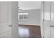 A bedroom with hardwood floors is seen through an open door at 3908 Total Eclipse St, Las Vegas, NV 89129