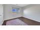 Bright bedroom with hardwood floors and a large window at 3908 Total Eclipse St, Las Vegas, NV 89129