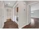 Hallway view with tile flooring, laundry closet, and doors to a bedroom and bath at 3908 Total Eclipse St, Las Vegas, NV 89129