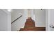 A hallway with hardwood floors connects different areas of the home at 3908 Total Eclipse St, Las Vegas, NV 89129
