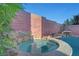 Inviting hot tub with rock detail at 3908 Total Eclipse St, Las Vegas, NV 89129