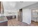 Open kitchen with stainless steel appliances, granite countertops, and wood floors at 3908 Total Eclipse St, Las Vegas, NV 89129