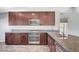 Spacious kitchen with stainless steel appliances, granite countertops, and custom cabinetry at 3908 Total Eclipse St, Las Vegas, NV 89129