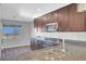 Granite countertops, stainless steel appliances, and a view from the kitchen sink at 3908 Total Eclipse St, Las Vegas, NV 89129