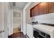 Convenient laundry area with washer, dryer, and upper cabinetry, adjacent to bathroom at 3908 Total Eclipse St, Las Vegas, NV 89129