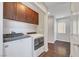 Functional laundry room featuring matching washer and dryer, complemented by storage cabinets at 3908 Total Eclipse St, Las Vegas, NV 89129