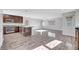 Open-concept living area with wood floors, stainless steel appliances and lots of natural light at 3908 Total Eclipse St, Las Vegas, NV 89129