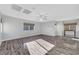 Spacious living room featuring hardwood floors, recessed lighting, and large windows at 3908 Total Eclipse St, Las Vegas, NV 89129