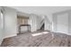 Open-concept living area with hardwood floors, stairs, and natural light at 3908 Total Eclipse St, Las Vegas, NV 89129