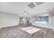 Bright and airy living room with hardwood floors and contemporary chandelier at 3908 Total Eclipse St, Las Vegas, NV 89129