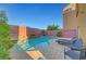 Inviting pool and spa area with waterfall feature, surrounded by a stone patio at 3908 Total Eclipse St, Las Vegas, NV 89129