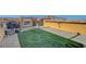 Expansive roof deck with turf, decor, hot tub, grill and views of the nearby mountains at 3908 Total Eclipse St, Las Vegas, NV 89129