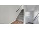 Carpeted stairway with handrails and a window at 3908 Total Eclipse St, Las Vegas, NV 89129