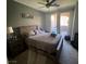 Serene bedroom featuring a comfortable bed, ample natural light, and a view of the outdoor patio at 3975 N Hualapai Way # 246, Las Vegas, NV 89129