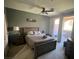 Serene bedroom featuring a comfortable bed, ample natural light, and a view of the outdoor patio at 3975 N Hualapai Way # 246, Las Vegas, NV 89129
