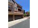 Exterior view showing the garage and the architecture of the townhome at 3975 N Hualapai Way # 246, Las Vegas, NV 89129