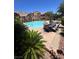 Community pool area featuring lounge chairs and dining sets for residents to enjoy at 3975 N Hualapai Way # 246, Las Vegas, NV 89129