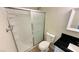 Bathroom featuring a shower with glass doors, toilet, vanity, and a neutral color scheme at 4238 Boratko St, Las Vegas, NV 89115