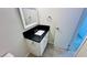 This bathroom includes tile flooring, a sleek vanity with modern finishes, and a framed mirror at 4238 Boratko St, Las Vegas, NV 89115