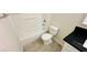 This bathroom features a tub/shower combo, toilet and vanity with dark countertop at 4238 Boratko St, Las Vegas, NV 89115