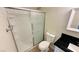 This is a bathroom featuring a shower with glass doors and towel racks at 4238 Boratko St, Las Vegas, NV 89115