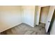 Neutral bedroom featuring gray carpet, closet, and an en suite bathroom at 4238 Boratko St, Las Vegas, NV 89115