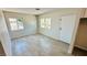 Bright bedroom with tiled floors, two windows, and a closet at 4238 Boratko St, Las Vegas, NV 89115