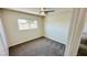 This is a bedroom with carpet flooring, neutral walls and ceiling fan at 4238 Boratko St, Las Vegas, NV 89115