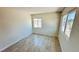 Bright bedroom with tile flooring, natural light, and view of the neighborhood at 4238 Boratko St, Las Vegas, NV 89115