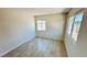 Neutral bedroom with tiled floors and natural light from windows at 4238 Boratko St, Las Vegas, NV 89115