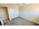 Bright bedroom with a closet, neutral walls, carpeted floors and access to another room at 4238 Boratko St, Las Vegas, NV 89115