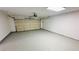 Bright and clean two car garage featuring an automatic garage door and epoxy painted floors at 4238 Boratko St, Las Vegas, NV 89115