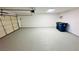 Spacious two car garage with an automatic garage door, painted floors and ample room for vehicles at 4238 Boratko St, Las Vegas, NV 89115