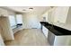 Renovated kitchen features white cabinets, black countertops and stainless steel appliances at 4238 Boratko St, Las Vegas, NV 89115