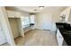 Bright kitchen featuring a built-in desk, white cabinetry, and updated appliances at 4238 Boratko St, Las Vegas, NV 89115