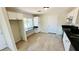 Updated kitchen with white cabinets, black countertops, and a built-in desk at 4238 Boratko St, Las Vegas, NV 89115