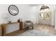 Inviting entryway with stylish decor, wood floors, and a modern light fixture at 5000 Linkside Dr, Las Vegas, NV 89130