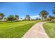 Expansive green golf course with a paved path at 5000 Linkside Dr, Las Vegas, NV 89130
