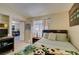 Bedroom with a twin bed, tiled floors, and access to the dining room at 5415 W Harmon Ave # 2075, Las Vegas, NV 89103