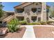 This condo building features an attractive facade, balconies, and well-maintained landscaping at 5415 W Harmon Ave # 2075, Las Vegas, NV 89103