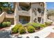 Comfortable condo with a patio, outdoor space, and attractive facade and landscaping at 5415 W Harmon Ave # 2075, Las Vegas, NV 89103