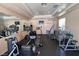 Community gym featuring various exercise machines and equipment with mirrored walls at 5415 W Harmon Ave # 2075, Las Vegas, NV 89103