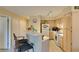 A kitchen features an eat-in counter and light wood cabinets at 5415 W Harmon Ave # 2075, Las Vegas, NV 89103