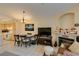 Open living and dining space featuring a fireplace, TV, and easy access to a modern kitchen at 5415 W Harmon Ave # 2075, Las Vegas, NV 89103
