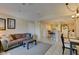 Open-concept living area flowing into the kitchen, complete with tile flooring and a neutral color scheme at 5415 W Harmon Ave # 2075, Las Vegas, NV 89103